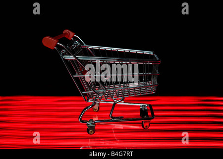 A miniature empty shopping cart Stock Photo