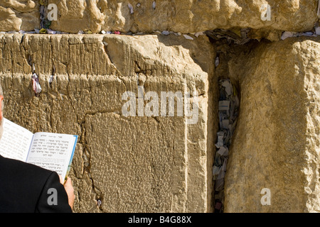 Man praying at the Wailing Wall, over the shoulder view, close-up Stock Photo