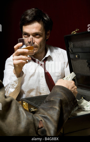 Two man doing a shady business deal Stock Photo