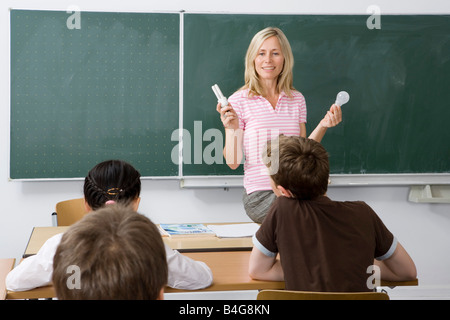 Teacher in front of her class Stock Photo