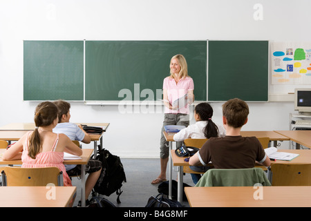 Teacher in front of her class Stock Photo