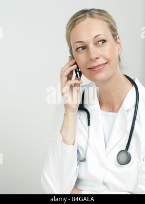 Portrait of a female doctor using a mobile phone Stock Photo