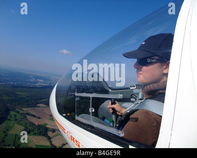 A young woman glider pilot outside view during the flight – Glider model ASK-21 - France Stock Photo