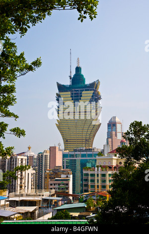 The 258 metres 846 feet 58 floors Grand Lisboa casino and hotel under construction rises above the skyline Macau China JMH3335 Stock Photo