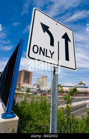 Traffic sign with directional arrows printed on it Stock Photo