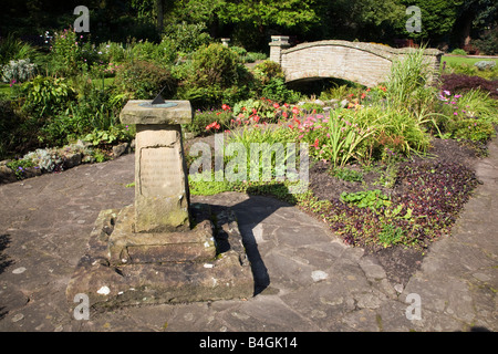 Bridge and sundial in Coronation gardens in the village of Waddington Lancashire Stock Photo