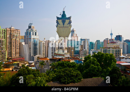 The 258 metres 846 feet 58 floors Grand Lisboa casino and hotel under construction rises above the skyline Macau China JMH3336 Stock Photo