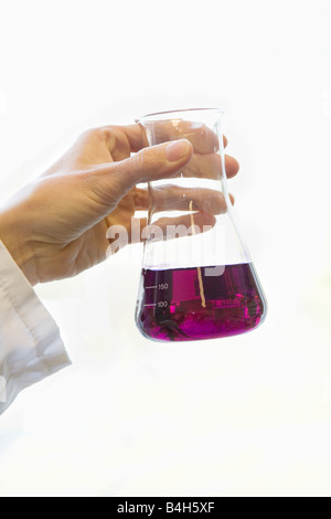 Scientist holding conical flask in laboratory Stock Photo