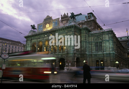 Cable car moving on tramway at dusk Vienna State Opera Vienna Austria Stock Photo