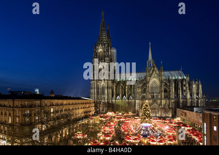 Aerial view of market lit up at dusk in front of cathedral Stock Photo