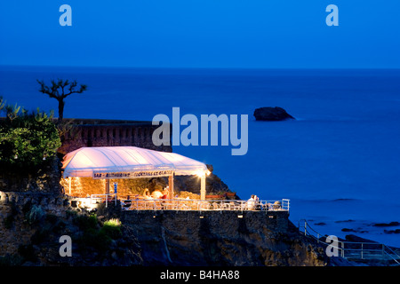 Restaurant lit up at night, Spain Stock Photo