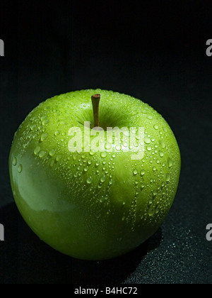 Close-up of water droplets on green apple Stock Photo