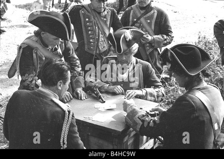 Burt Lancaster playing cards with his actor colleagues during the filming of The Devils Disciple July 1958 Stock Photo
