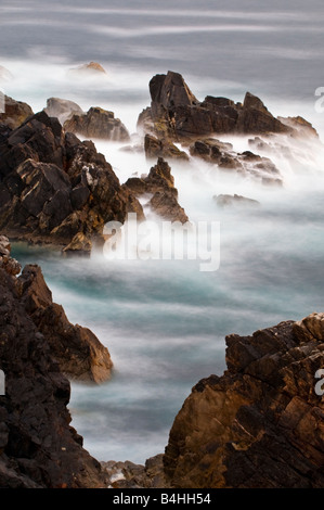 Waves crashing on the rugged coastline of the Isle of Lewis Scotland Stock Photo