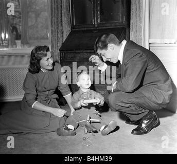 American Comedian and actor Jerry Lewis at home with his wife playing with their son April 1958 Stock Photo