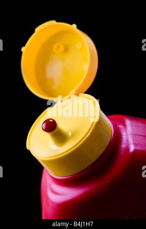 Ketchup bottle isolated on black background Stock Photo