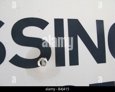 Bullet hole in a passing place sign on narrow road, Scotland Stock Photo