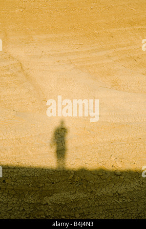 Shadow of a Man on Arid Ground Stock Photo - Alamy
