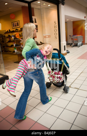 little girl having a tantrum in a shopping centre Stock Photo