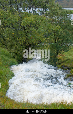 Turbulent water following heavy rains rush down a Sutherland Hillside in North West Scotland Stock Photo