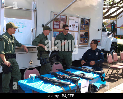 Members of the Redondo Beach police dept swat team chat during safety fair Stock Photo