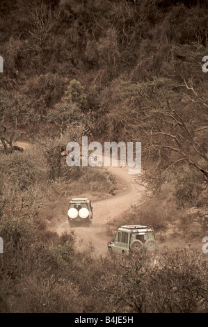 Jeeps descending into Ngorongoro Crater Africa Tanzania Stock Photo
