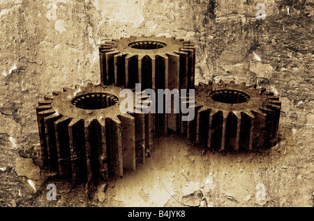 Interlocking gears on textured grunge background Stock Photo