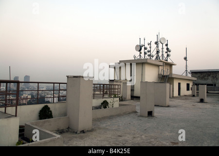 Satellite dishes for tv on the roof of an apartment building in Dhaka Stock Photo