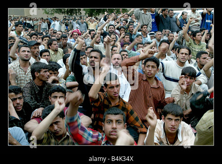 Iraq war 2003 April 2003 Angry crowds gather outside The Palestine Hotel in Baghdad to protest about The Americans occupation A Stock Photo