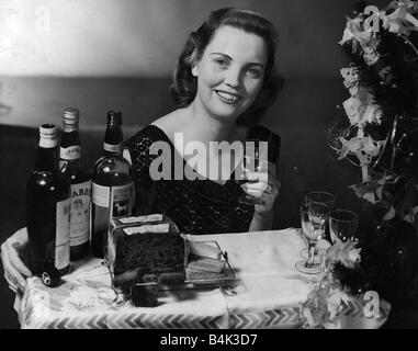Hogmanay celebrations whisky shortbread black bun cake circa 1949 Stock Photo