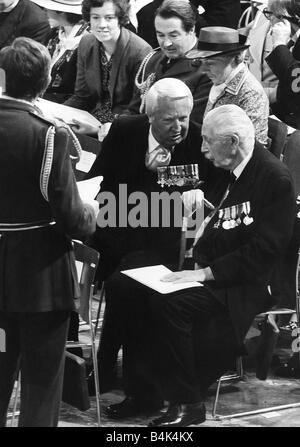 Harold MacMillan former Prime Minister talks to Edward Ted Heath former Prime Minister at a Thanksgiving Service Stock Photo