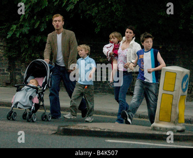 Actor Jude Law and actress wife Sadie Frost with their children go out for a pub meal near North London home 4th June 2003 Stock Photo