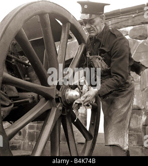 The Gunner getting the gun ready for firing which is fired automatically by a nearby electric clock precisely at 1pm everyday at the royal scottish Observatory on Blackford Hill Overlooking Edinburgh Circa 1945 Stock Photo