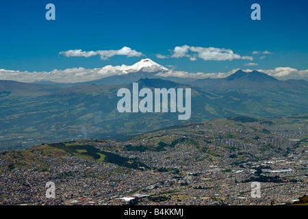 View of Quito and Cotopaxi volcano, from summit of Pichincha volcano, Quito, Ecuador. Stock Photo