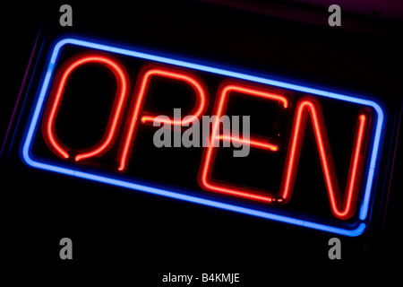 A neon OPEN sign glowing red in the window of a restaurant Stock Photo