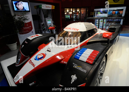 A Formula One racing car sponsored by ench Froil giant Total exhibited at the Paris International Auto Motor Show. Stock Photo