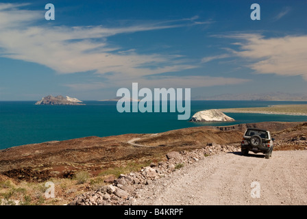 Vehicle on dirt road at Sea of Cortez coastline south of Puertecitos Baja California Mexico Stock Photo
