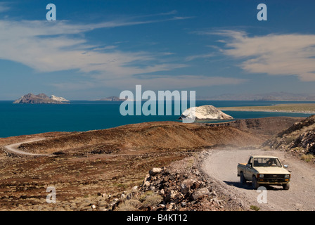 Pick up truck on dirt road at Sea of Cortez coastline south of Puertecitos Baja California Mexico Stock Photo