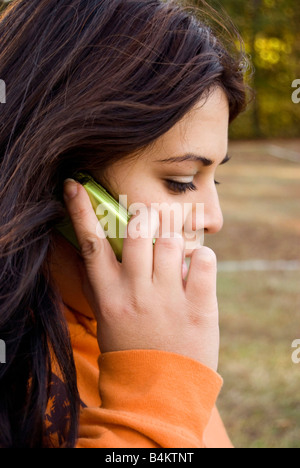 A beautiful young woman of latin descent talking on a cell phone Stock Photo