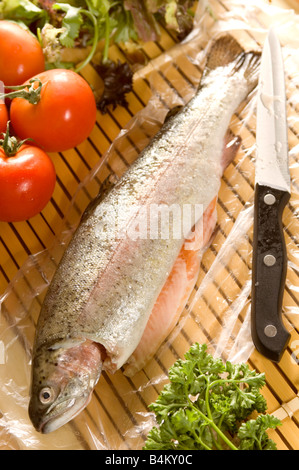 a fresh rainbow trout being prepared for cooking Stock Photo