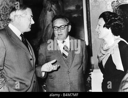 Dr Henry Kissinger Secretary of State of America centre with Prime Minister James Callaghan left and US Ambassador in London Mrs Anne Armstrong Stock Photo