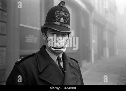 Policeman in smog mask December 1962 PC John Finn from Snow Hill Police Station in the London smog of 1962 He is wear a mask to Stock Photo