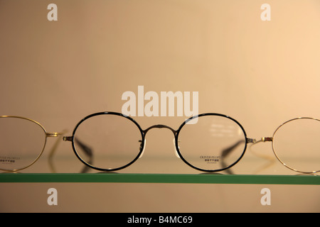 Designer spectacle frames on display in an optician s store Stock Photo