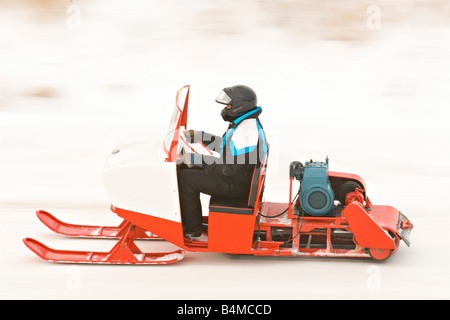 Vintage snowmobiles parade at the I 500 Snowmobile race in Sault Ste Marie Michigan Stock Photo