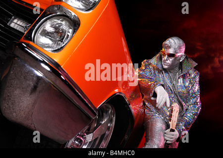 License and prints at MaximImages.com - Silver Elvis with a guitar and a classic retro american car Stock Photo