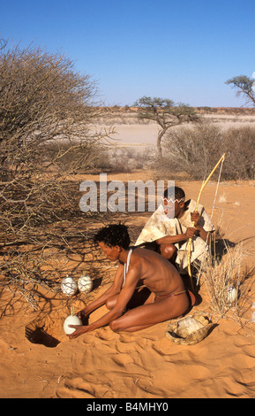 Namibia Kalahari desert near Keetmanshoop. Bushman using ostrich egg as waterbottle Stock Photo