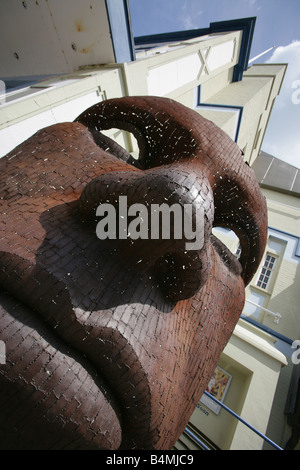 City of Canterbury, England. Mild steel sculpture named Mask by Rick Kirby outside the entrance to old (now redeveloped) Canterbury’s Marlowe Theatre. Stock Photo