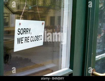 A sign saying Sorry, we're closed Stock Photo