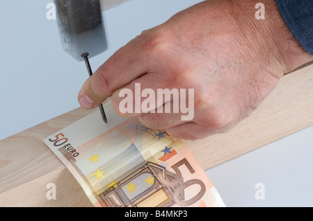nailing a euro banknote