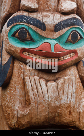 Close up of native tribal totem pole on display in Sitka Alaska